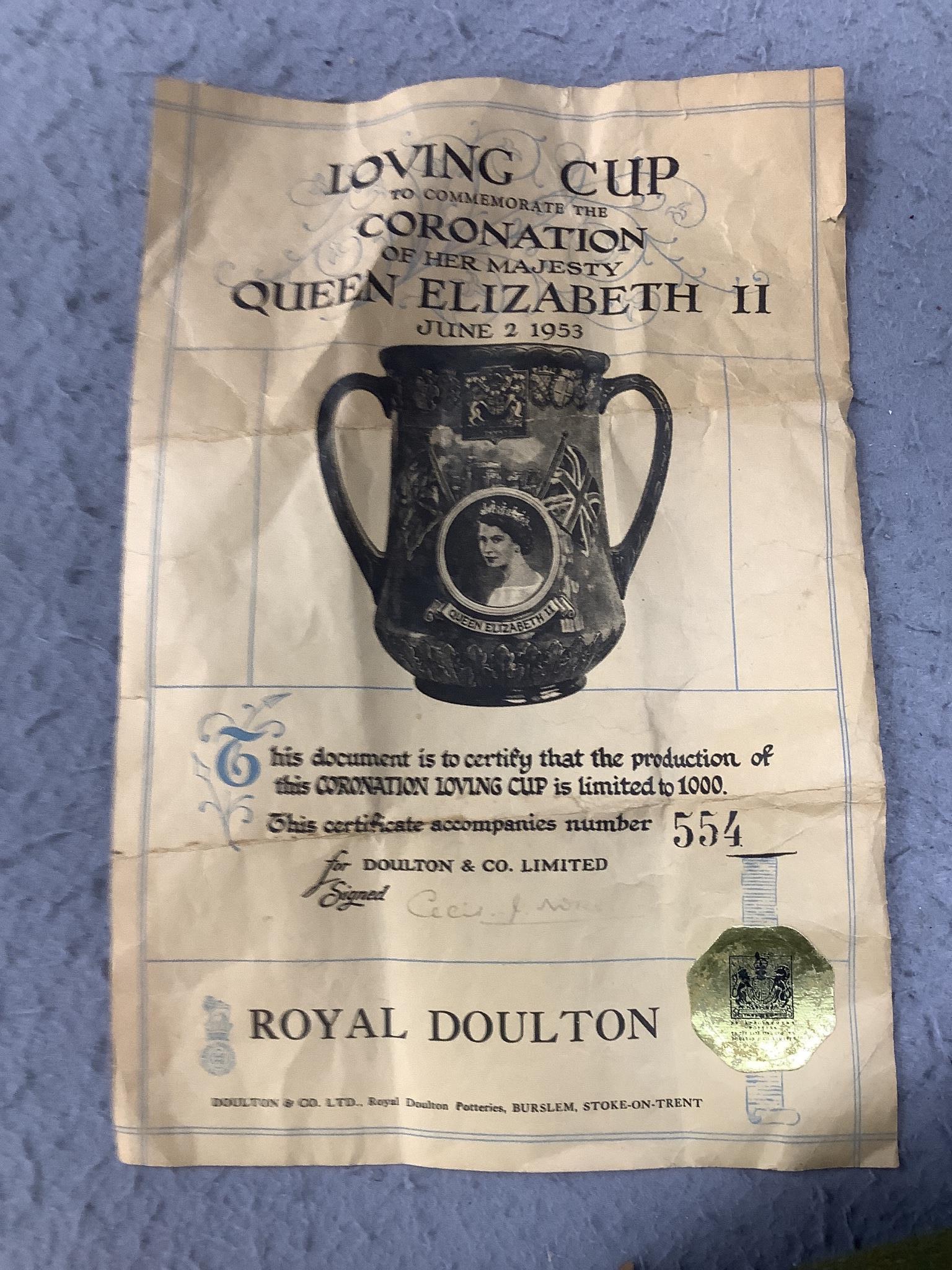 A Royal Doulton Elizabeth II silver jubilee commemorative loving cup, 1977, limited edition number 112 of 250, 27cm tall